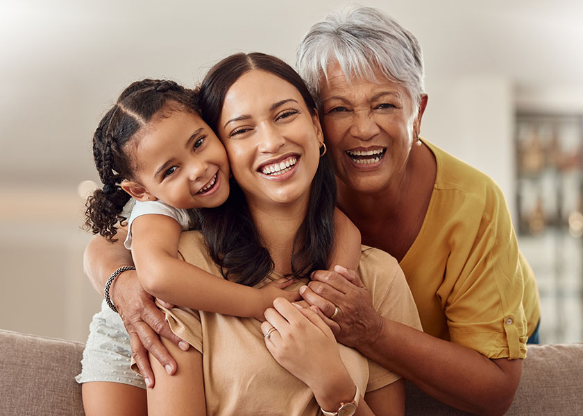 Smiling mom with child and grandma